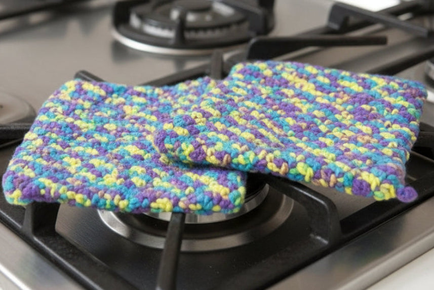 2 handmade crocheted potholders.