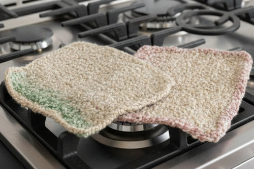 Green textured mat on a pink surface with plastic wrap underneath
