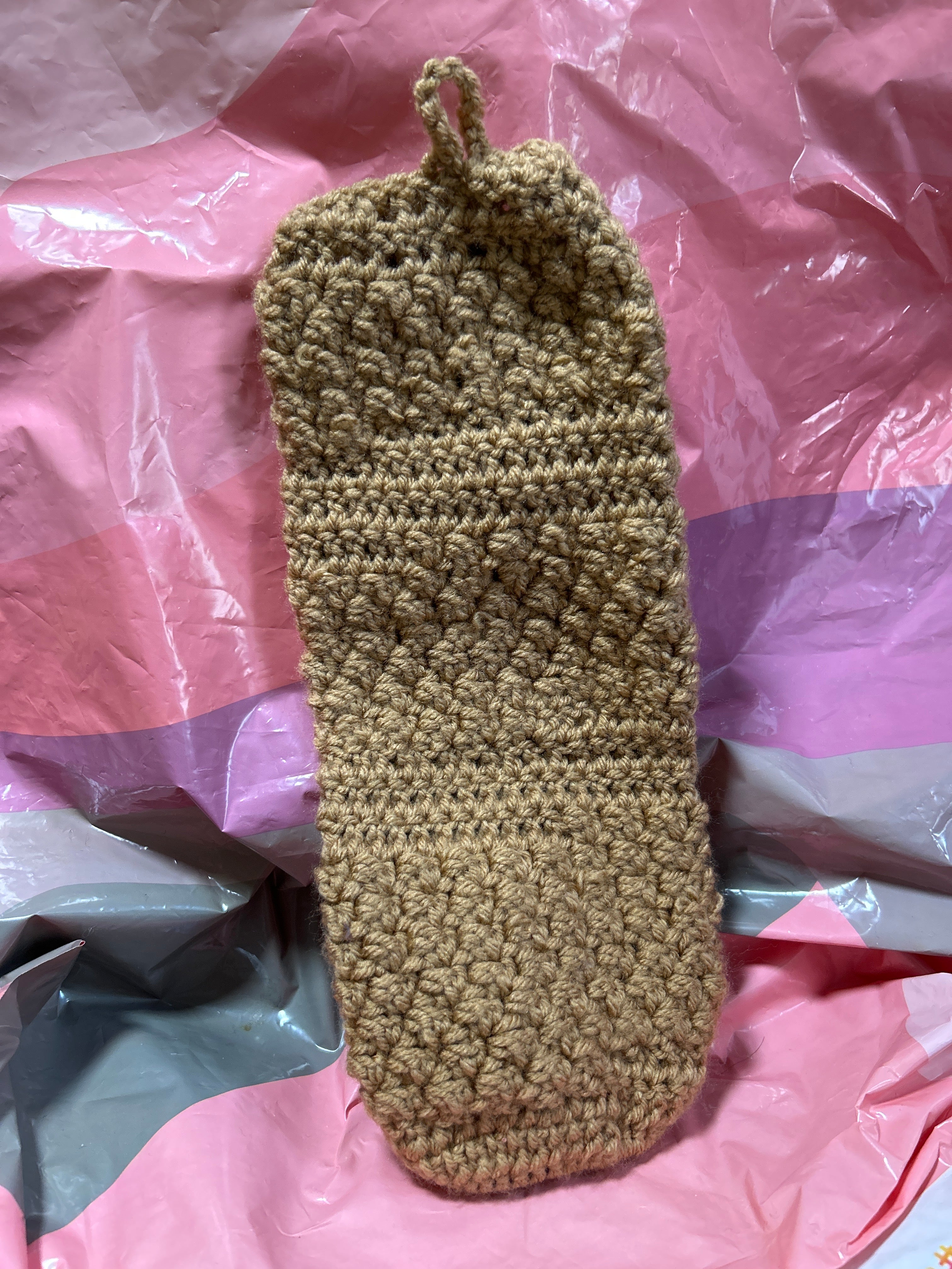 Brown crocheted handmade plastic bag holder
