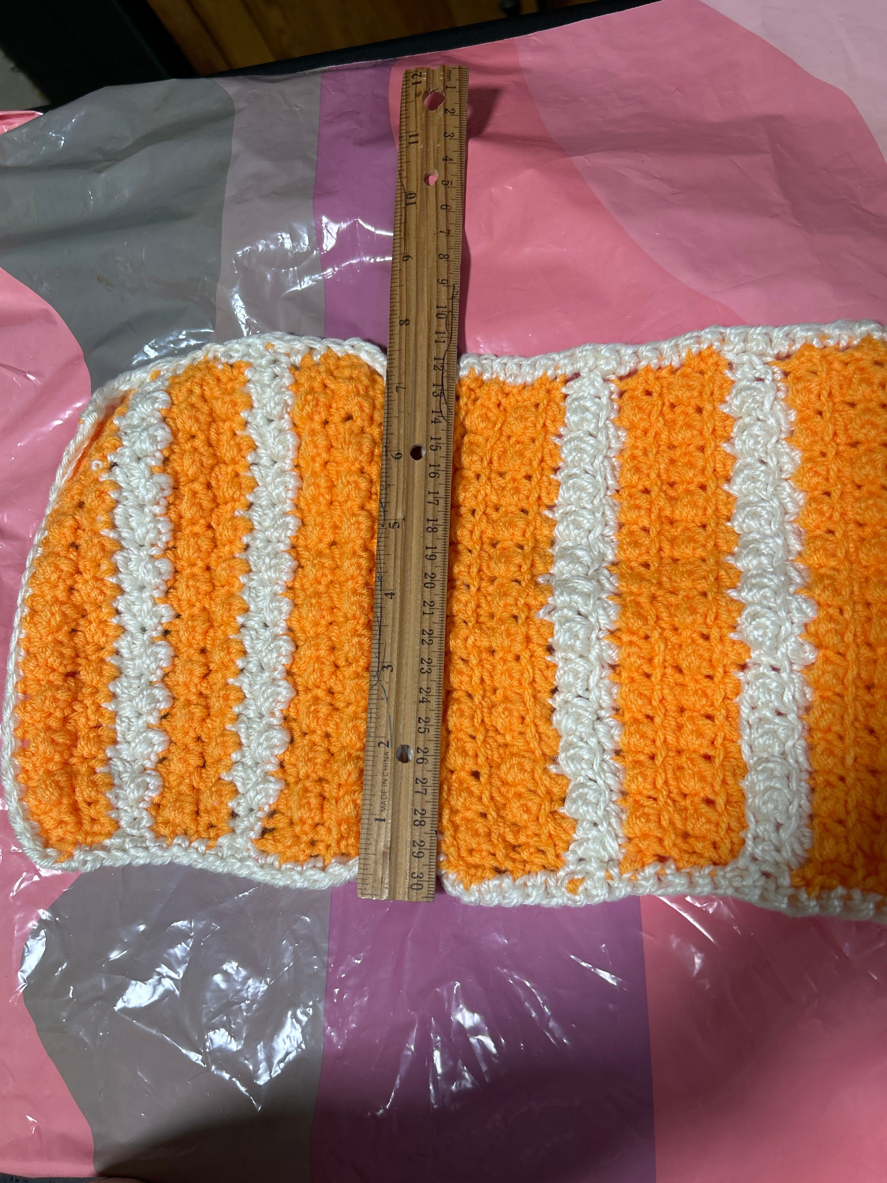 2 handmade crocheted potholders in orange & white